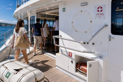 People embarking on a boat, the safety gear looks badly maintained